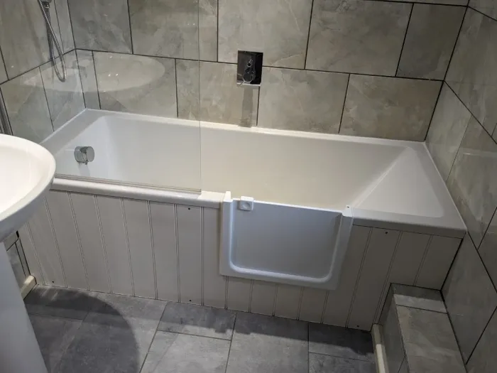 A panelled bath with a UDOOR® door fitted
